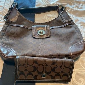 Coach shoulder bag with matching wallet.